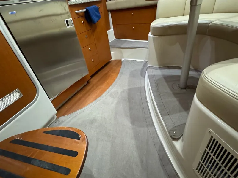 Slide: The Image of Interior of 2005 Chaparral Signature 310 boat with seating and kitchen area. - 41