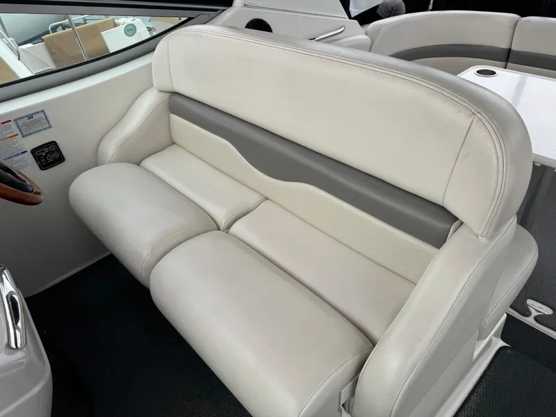 Slide: The Image of 2005 Chaparral Signature 310 boat interior with beige leather seating. - 44