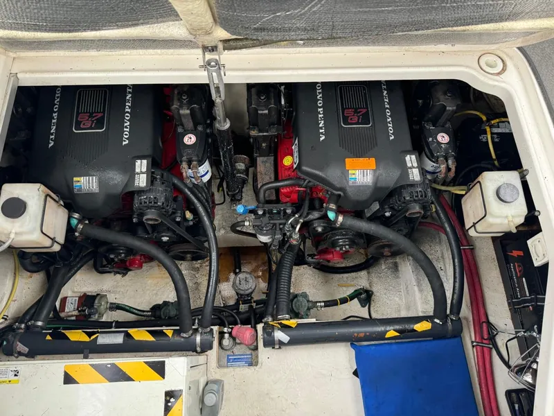 Slide: The Image of Engine compartment of a 2005 Chaparral Signature 310 boat, featuring dual Volvo Penta engines. - 45