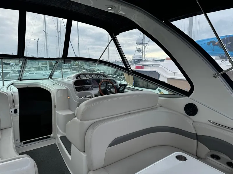 Slide: The Image of 2005 Chaparral Signature 310 boat interior with helm, seating, and dashboard. - 9