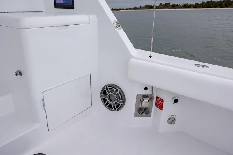 Slide: The Image of Hatteras 60 Convertible 2000 yacht deck with speaker and storage compartment. - 17