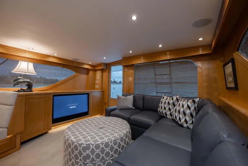 Slide: The Image of Luxurious interior of 2000 Hatteras 60 Convertible yacht with plush seating and modern decor. - 39