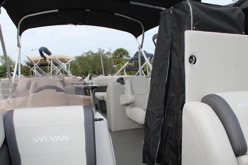 Slide: The Image of Control panel of 2025 Sylvan Mirage 822 LZ boat, featuring audio system interface. - 11