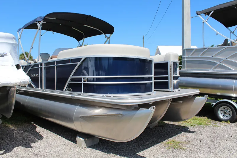 Slide: The Image of 2025 Sylvan Mirage 822 LZ boat interior with steering wheel and dashboard controls. - 3