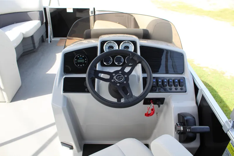 Slide: The Image of 2025 Sylvan Mirage 822 LZ pontoon boat interior with beige seating and cup holders. - 4