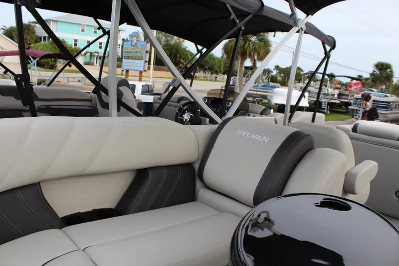 Slide: The Image of Steering console of 2025 Sylvan Mirage 822 LZ pontoon boat, featuring modern controls and gauges. - 9