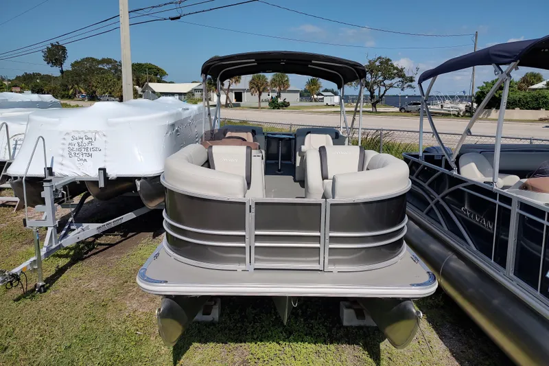 Slide: The Image of 2025 Sylvan Mirage 822 LZ pontoon boat displayed outdoors on a sunny day. - 14
