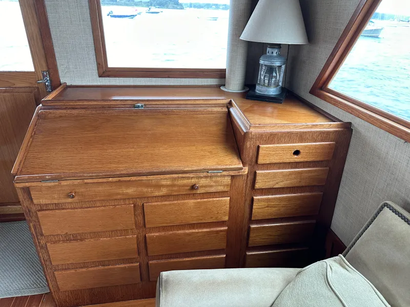 Slide: The Image of 1986 Wilbur Hunt Yachts interior with wooden cabinetry and nautical decor. - 16