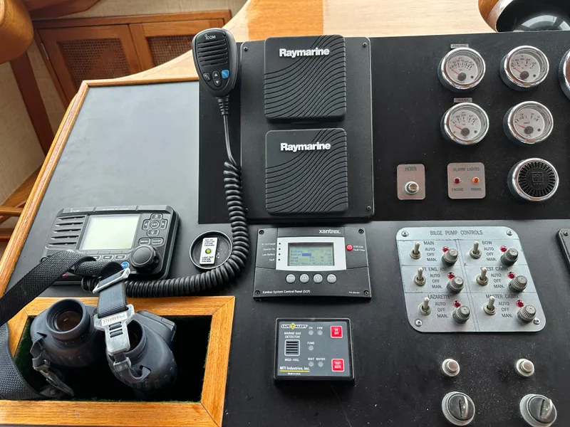 Slide: The Image of Control panel of a 1986 Wilbur Hunt Yachts with navigation and communication equipment. - 27