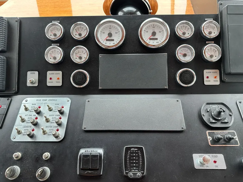 Slide: The Image of Control panel of a 1986 Wilbur Hunt Yachts boat with gauges and switches. - 28