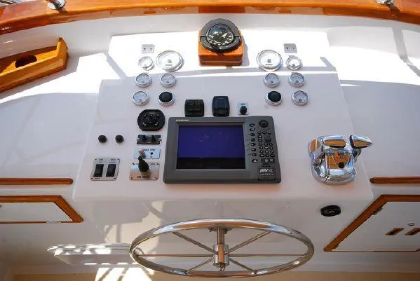 Slide: The Image of 1986 Wilbur Hunt Yachts helm with navigation instruments and steering wheel. - 39