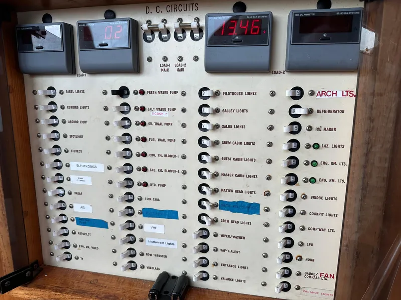 Slide: The Image of Electrical panel on a 1986 Wilbur Hunt Yachts boat, showing DC circuits and digital displays. - 41