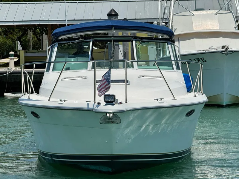 Slide: The Image of 2000 Tiara Yachts 3100 Open boat docked in marina, front view. - 23