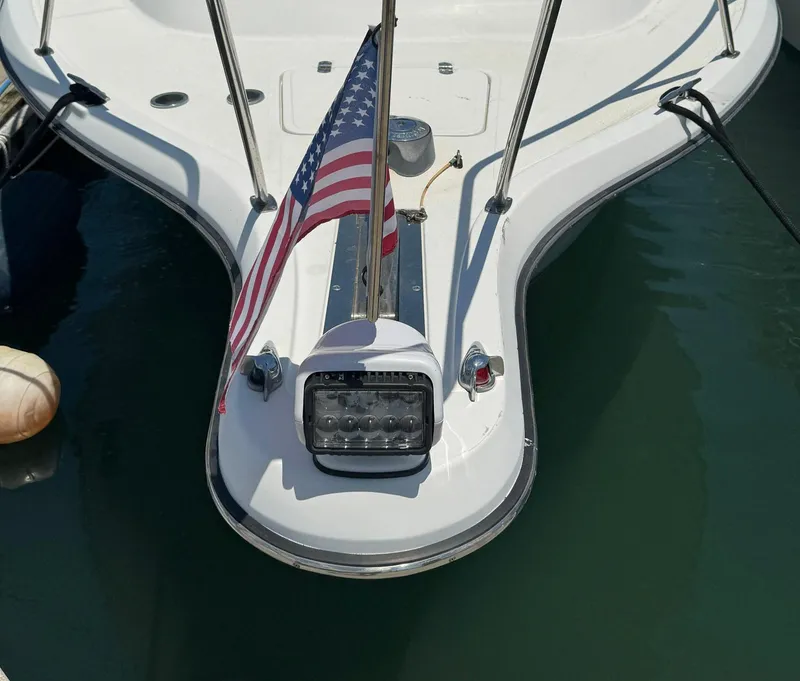 Slide: The Image of Bow of 2000 Tiara Yachts 3100 Open with American flag and spotlight. - 25
