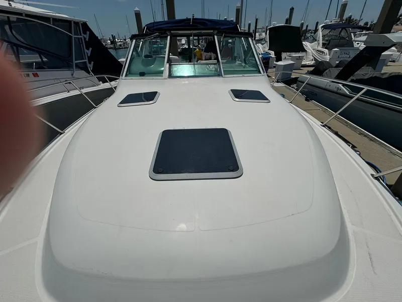 Slide: The Image of 2000 Tiara Yachts 3100 Open boat docked at marina, front deck view. - 27