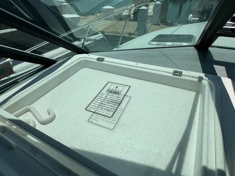Slide: The Image of Tiara Yachts 3100 Open 2000 model, deck hatch detail with caution label. - 34