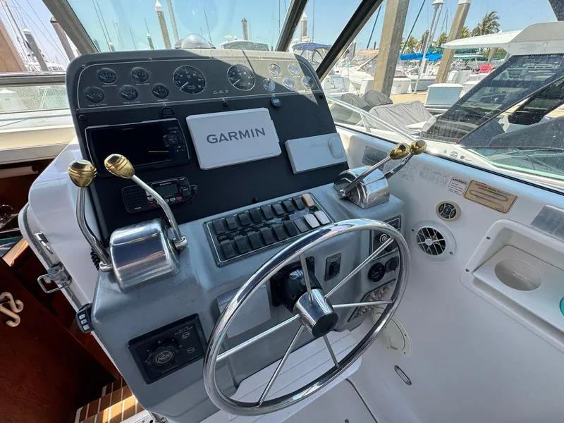 Slide: The Image of Tiara Yachts 3100 Open 2000 helm with Garmin navigation system and dual throttle controls. - 39