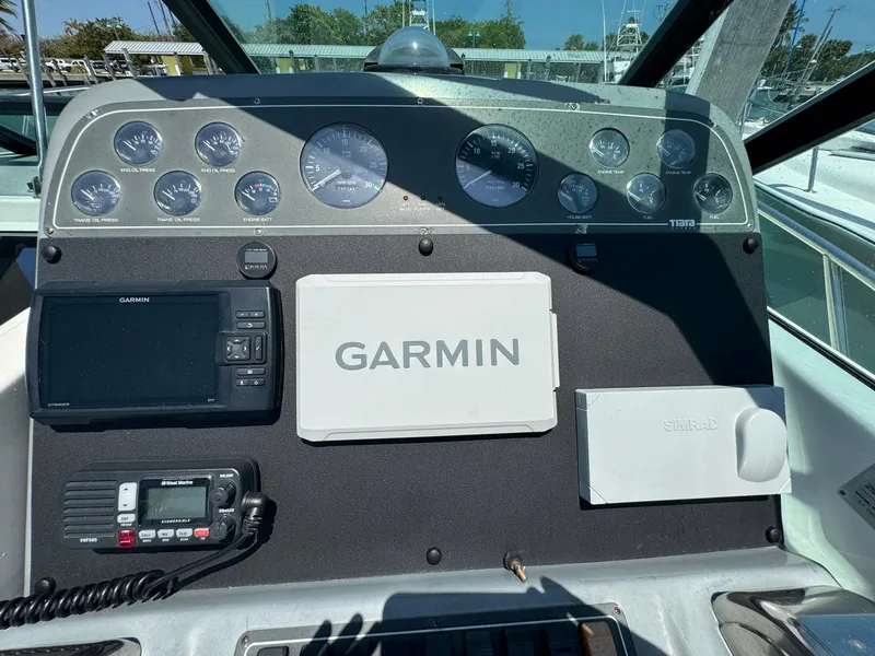 Slide: The Image of Dashboard of 2000 Tiara Yachts 3100 Open with Garmin navigation system. - 40
