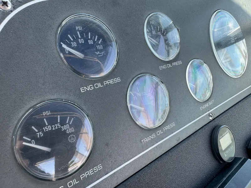 Slide: The Image of Dashboard gauges of a 2000 Tiara Yachts 3100 Open, showing engine and transmission oil pressure. - 41