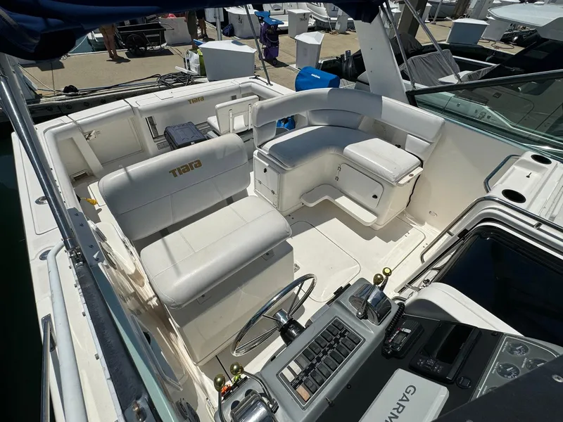 Slide: The Image of 2000 Tiara Yachts 3100 Open boat interior with white seating and control panel. - 44
