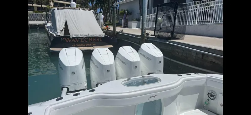 Slide: The Image of 2023 Yellowfin 39 Offshore boat with four Mercury outboard engines docked in marina. - 12