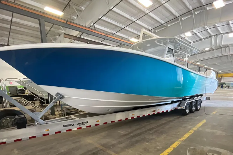 Slide: The Image of 2023 Yellowfin 39 Offshore boat on trailer in warehouse. - 2