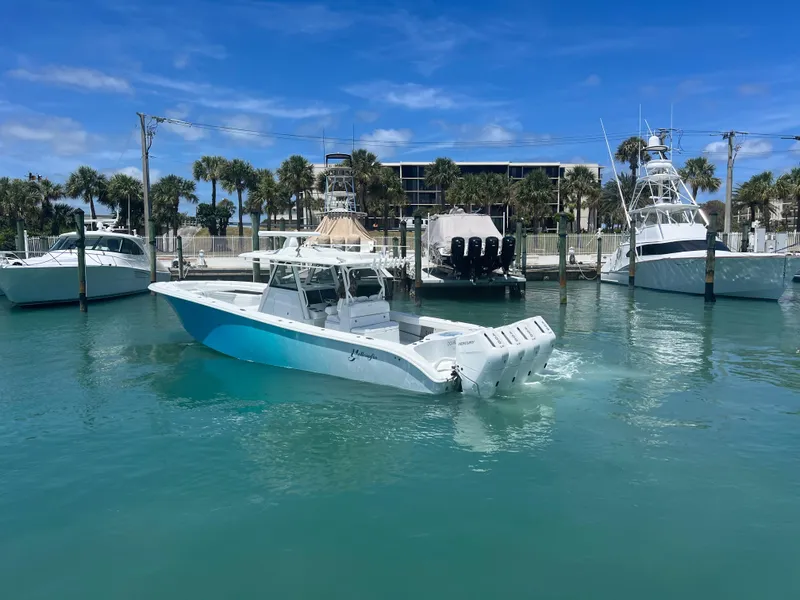 Slide: The Image of 2023 Yellowfin 39 Offshore boat in marina, clear blue water, sunny day. - 4