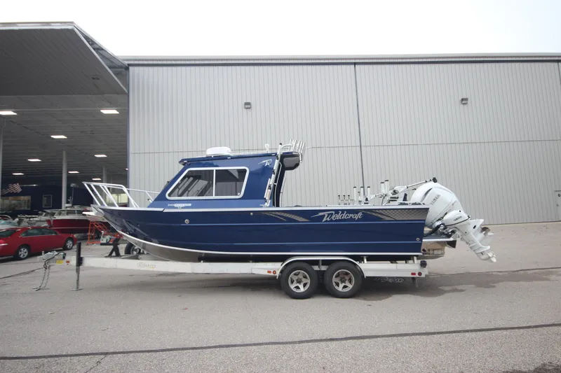 Slide: The Image of 2025 Weldcraft 240 Ocean King boat on trailer, Great Lakes Edition, blue exterior. - 0