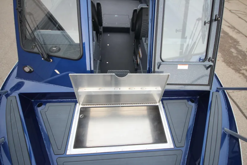 Slide: The Image of 2025 Weldcraft 240 Ocean King boat interior with open storage compartment. - 10