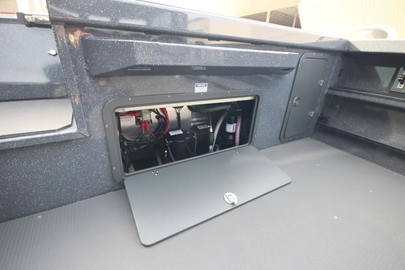 Slide: The Image of 2025 Weldcraft 240 Ocean King boat storage compartment with open hatch. - 14