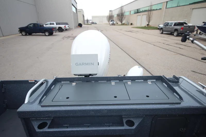 Slide: The Image of 2025 Weldcraft 240 Ocean King boat with Garmin equipment, parked outdoors. - 18