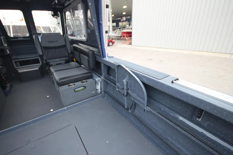 Slide: The Image of Interior of 2025 Weldcraft 240 Ocean King boat, featuring spacious seating and modern design. - 20