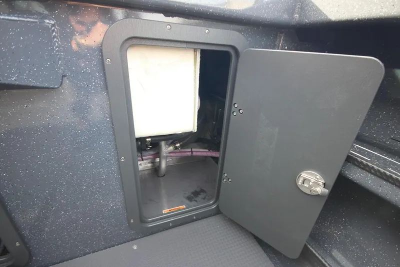 Slide: The Image of 2025 Weldcraft 240 Ocean King F350XSA2 storage compartment with open door. - 21
