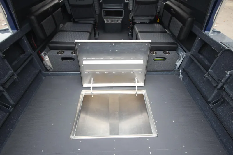 Slide: The Image of 2025 Weldcraft 240 Ocean King interior with open hatch, seating, and storage. - 27