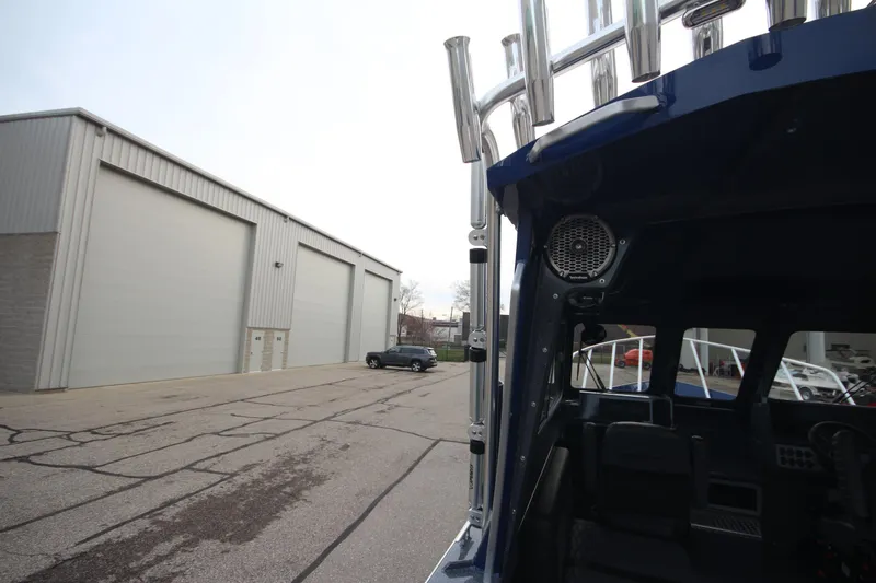 Slide: The Image of 2025 Weldcraft 240 Ocean King boat near industrial building, Great Lakes Edition. - 30