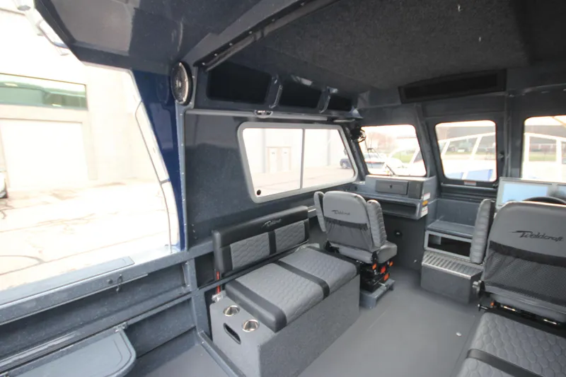Slide: The Image of Interior of 2025 Weldcraft 240 Ocean King boat, featuring seating and storage. - 31