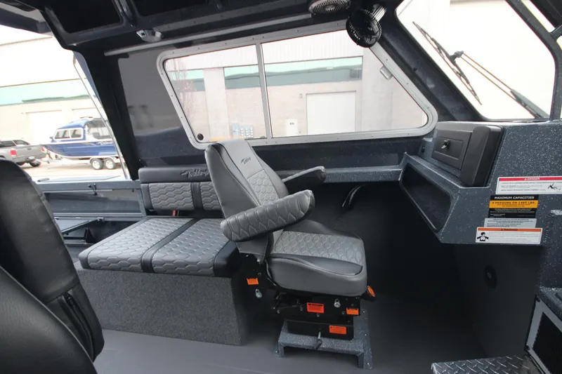 Slide: The Image of Interior of 2025 Weldcraft 240 Ocean King boat, featuring modern seating and dashboard. - 33