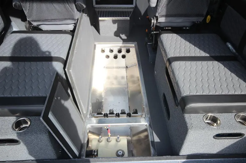 Slide: The Image of 2025 Weldcraft 240 Ocean King interior with open storage compartment and seating. - 43