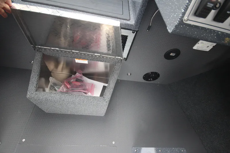 Slide: The Image of 2025 Weldcraft 240 Ocean King storage compartment with open lid, showcasing interior details. - 44