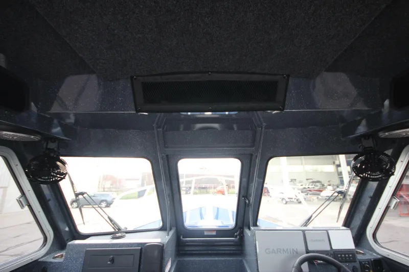 Slide: The Image of Interior view of 2025 Weldcraft 240 Ocean King boat cockpit with Garmin navigation system. - 45