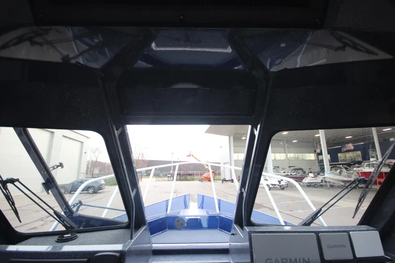 Slide: The Image of Interior view of 2025 Weldcraft 240 Ocean King boat, showcasing windshield and dashboard. - 46
