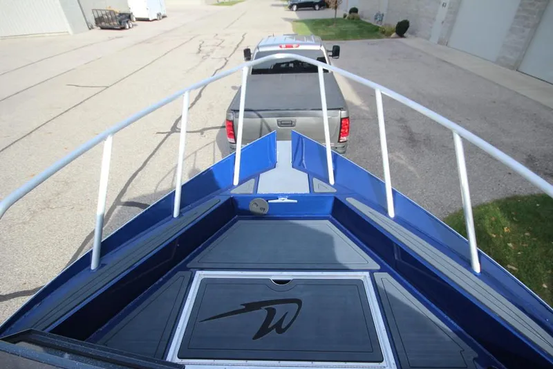 Slide: The Image of 2025 Weldcraft 240 Ocean King boat on trailer, viewed from bow, ready for transport. - 8