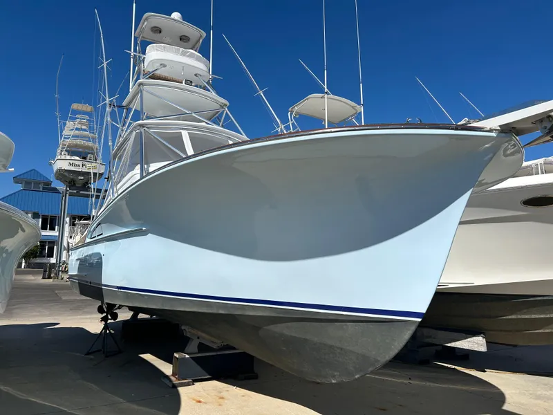 The Image of 2006 Miller 36 Express boat on display in a marina. - 39