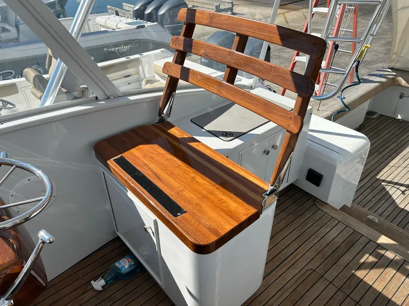 Slide: The Image of Wooden bench seat on 2006 Miller 36 Express boat deck. - 47
