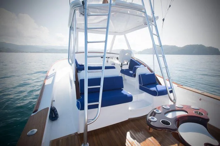 Slide: The Image of 2025 Maverick Yachts Costa Rica 36 Walkaround with blue seating on calm waters. - 8