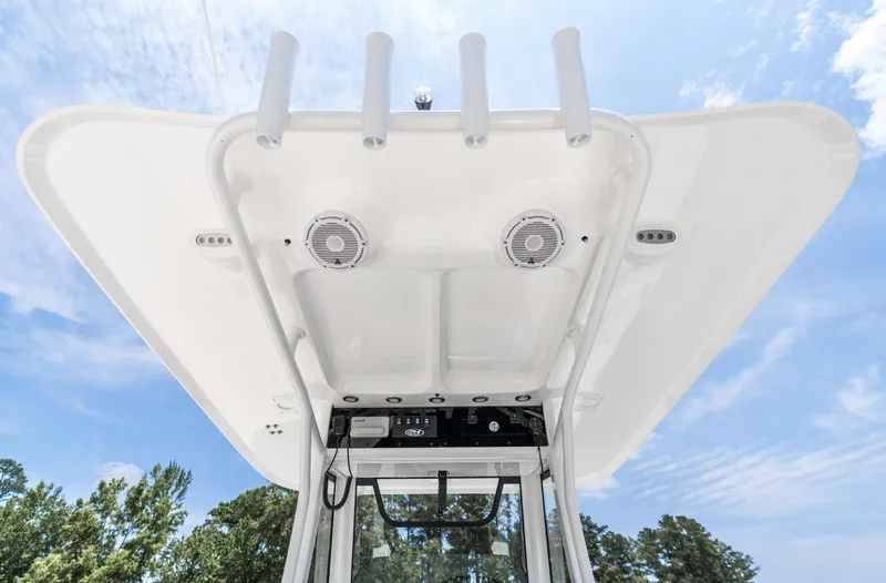 Slide: The Image of 2025 Sea Hunt Ultra 305 SE boat canopy with speakers and rod holders. - 11