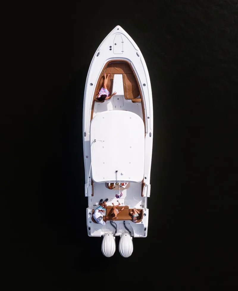 Slide: The Image of Aerial view of 2025 Sea Hunt Ultra 305 SE boat on dark water. - 23