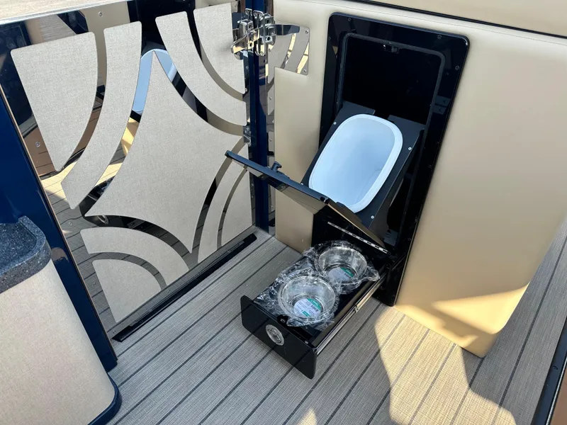 Slide: The Image of Balise HORIZON 24L 2025 boat interior with modern design and storage compartment. - 14