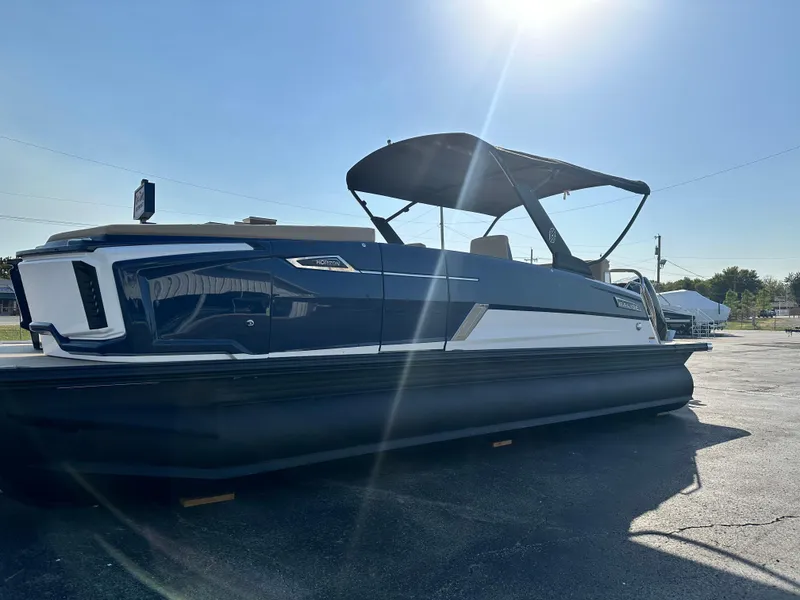 Slide: The Image of 2025 Balise HORIZON 24L pontoon boat with canopy in sunny outdoor setting. - 3