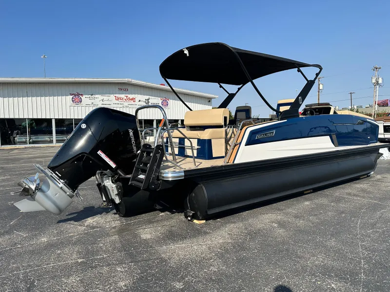 Slide: The Image of 2025 Balise HORIZON 24L boat with canopy and powerful outboard motor. - 6